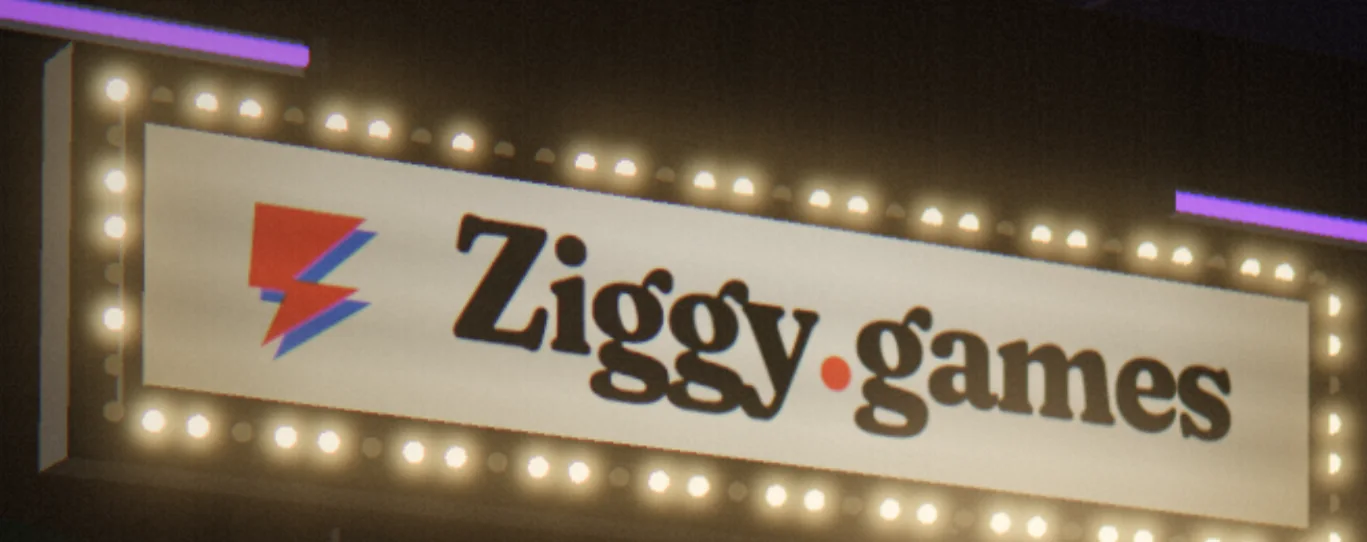 The lit Ziggy.games marquee in the arcade, ringed with bulbs